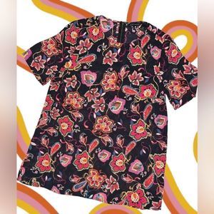 Groovy print on black. Light, breezy short sleeve blouse.